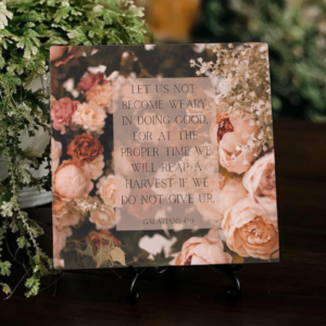 floral inspirational ceramic tile against greenery