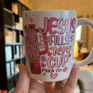 white coffee cup with inspirational words against indoor background