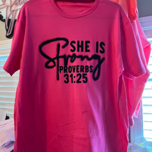 pink t shirt with inspirational writing on white background